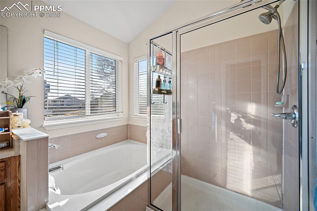 Image 25 of 48: 5 piece primary bathroom with a large walk-in closet