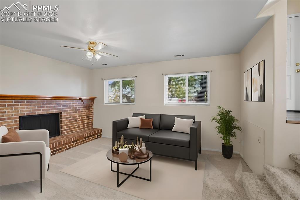 Image 21 of 45: Virtually staged lower living room