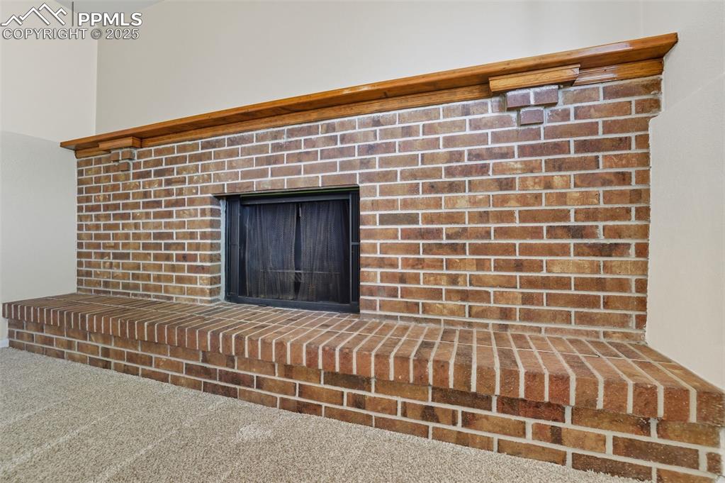 Image 24 of 45: fireplace in lower level