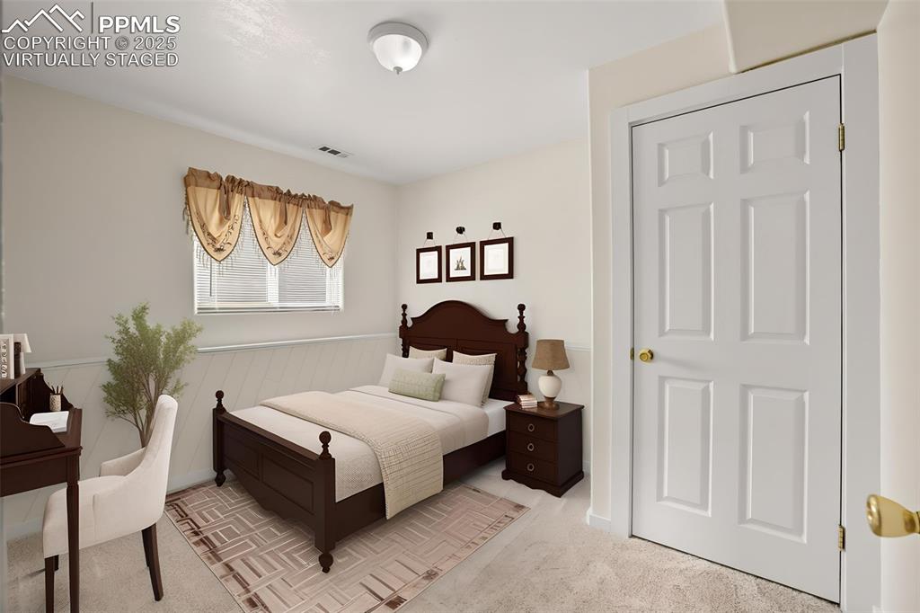 Image 25 of 45: lower level 3rd bedroom virtually staged