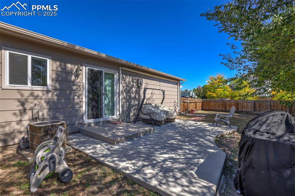 Image 34 of 45: Large patio with retractable cover