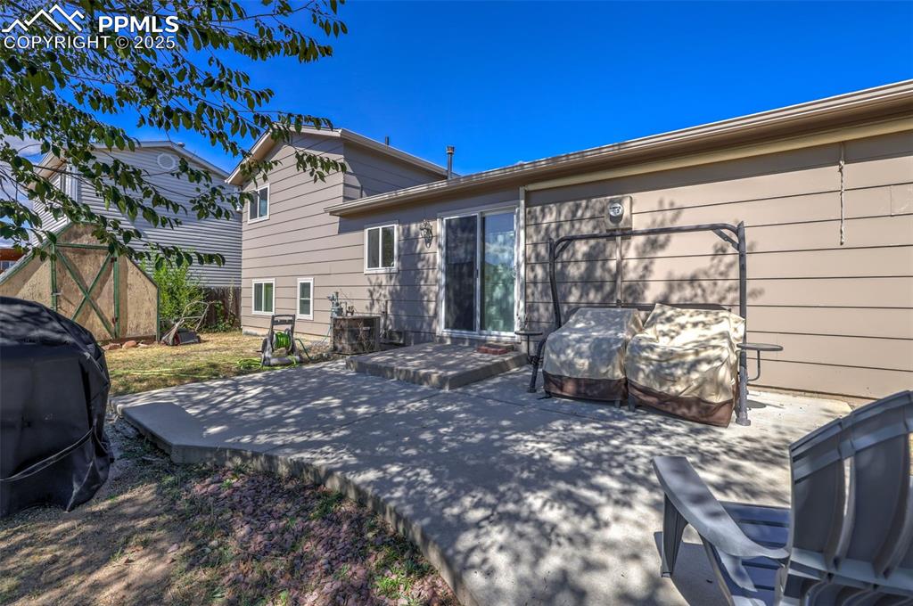 Image 35 of 45: large patio with retractable cover