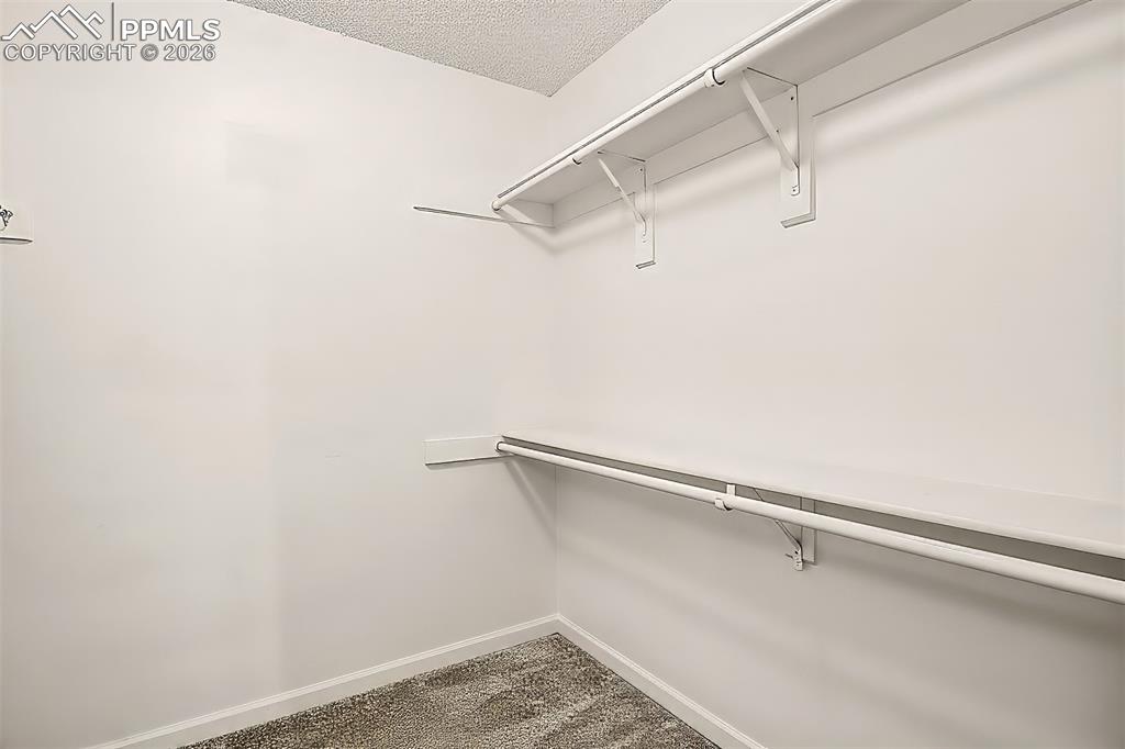 Image 13 of 36: Large Walk-In Closet in Primary Bedroom 