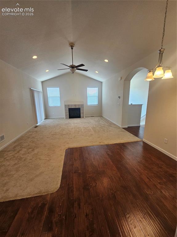 Image 6 of 32: Living room featuring wood flooring and a window for natural light