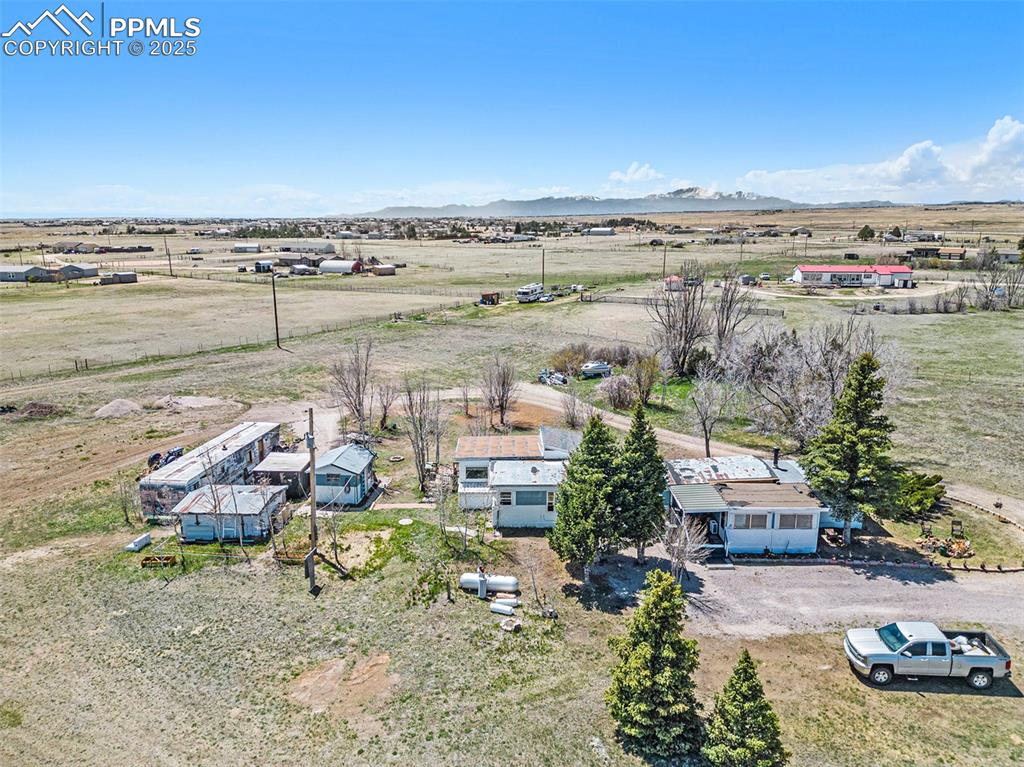 Image 20 of 25: Birds eye view of property featuring a mountain view and a rural view