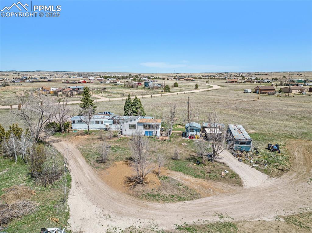 Image 22 of 25: Birds eye view of property with a rural view