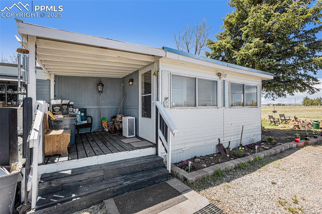 Image 3 of 25: View of front of house with a deck