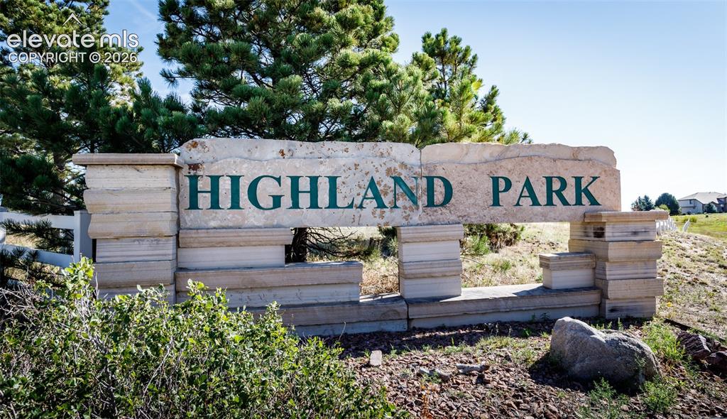 Image 2 of 48: Stone-clad entry sign featuring "Highland Park" lettering with a natural st