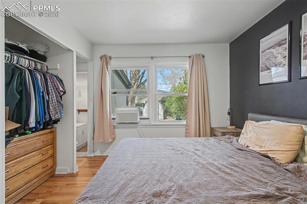 Image 17 of 28: Bedroom with light wood finished floors