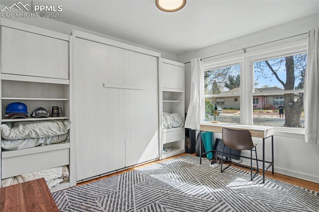 Image 19 of 28: Office space with light wood-type flooring and baseboards