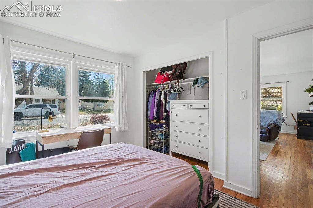 Image 20 of 28: Bedroom featuring dark wood-type flooring and a closet