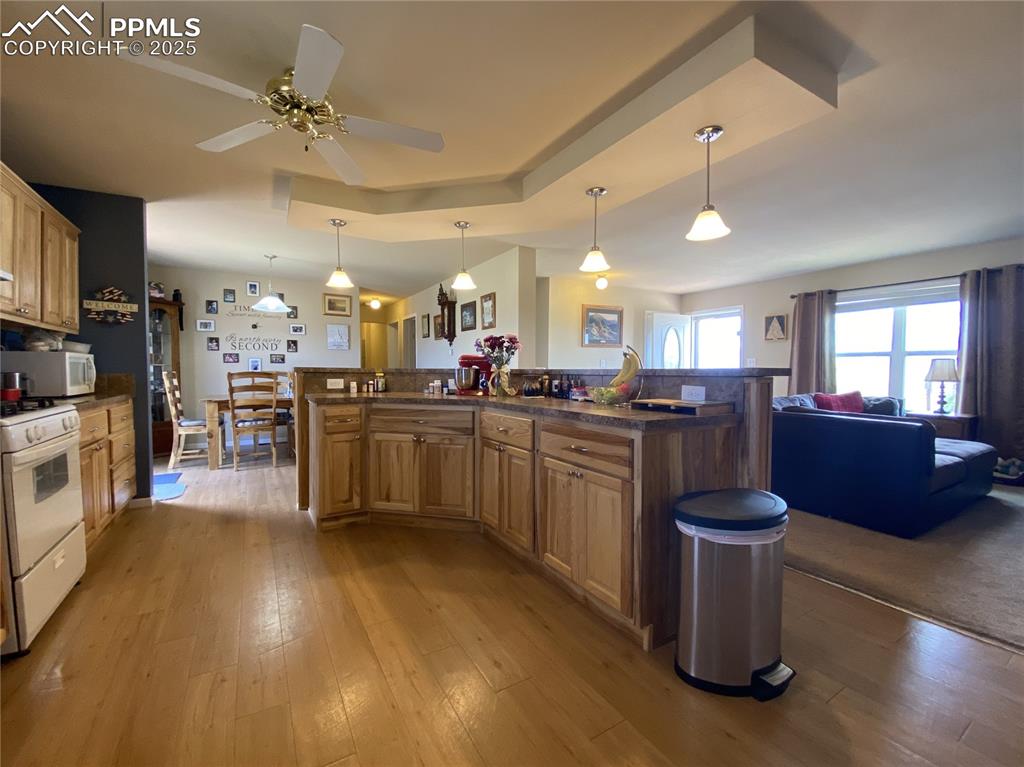 Image 12 of 48: Everyone can stay connected with the open floor plan