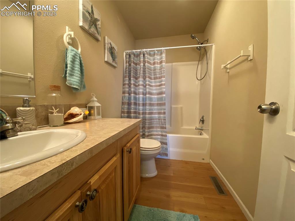 Image 18 of 48: A full bathroom serves these bedrooms and any guests