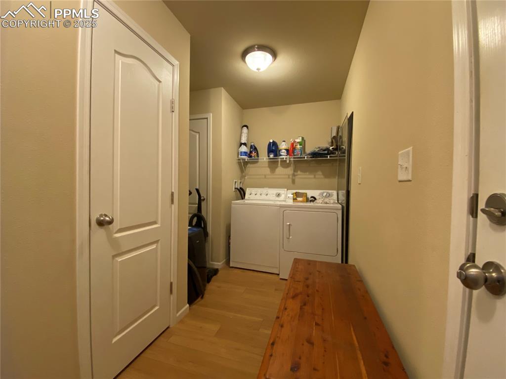 Image 19 of 48: The laundry room is tucked around the corner (with a door to a princess dec