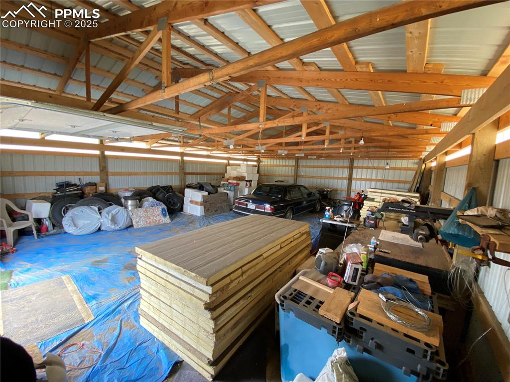 Image 35 of 48: Garage with metal wall