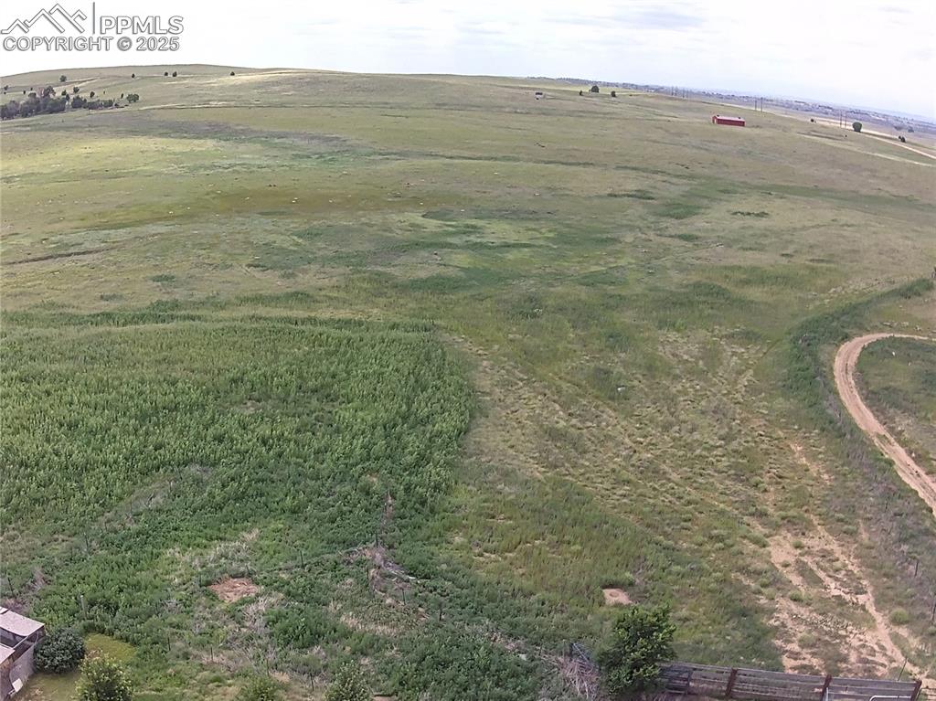 Image 48 of 48: Aerial view of property and surrounding area with rural landscape