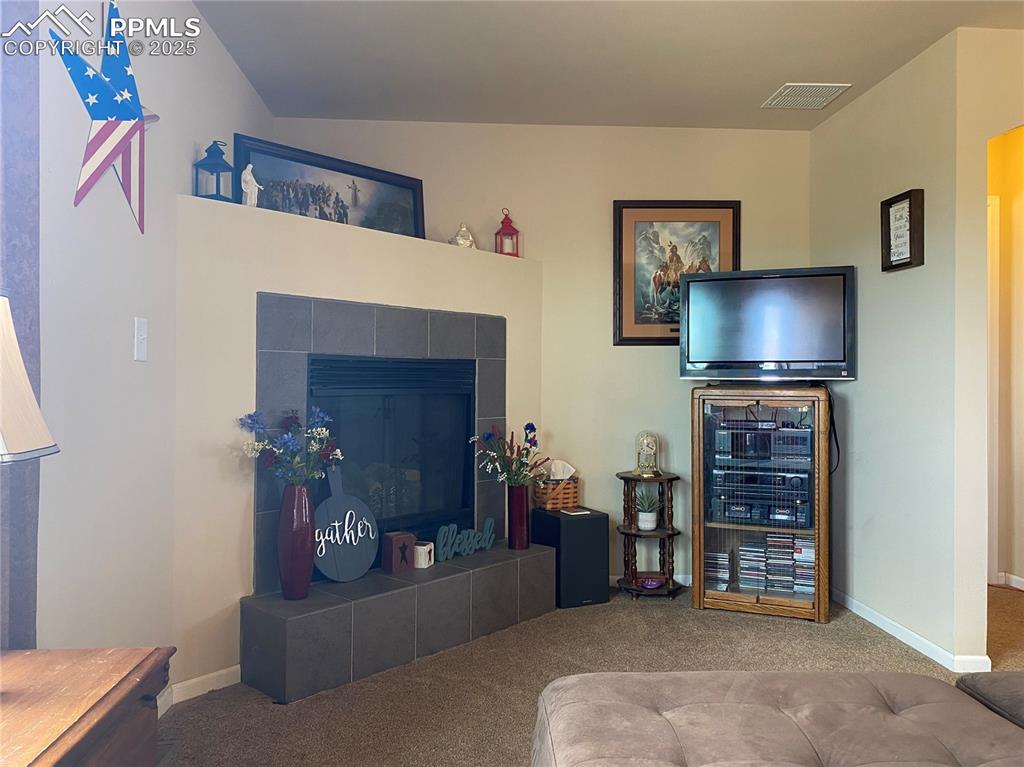 Image 7 of 48: And a gas insert fireplace to gather around