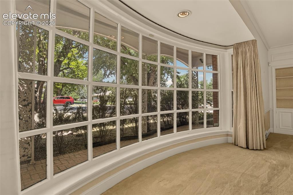 Image 10 of 49: Living room, with view into foyer.
