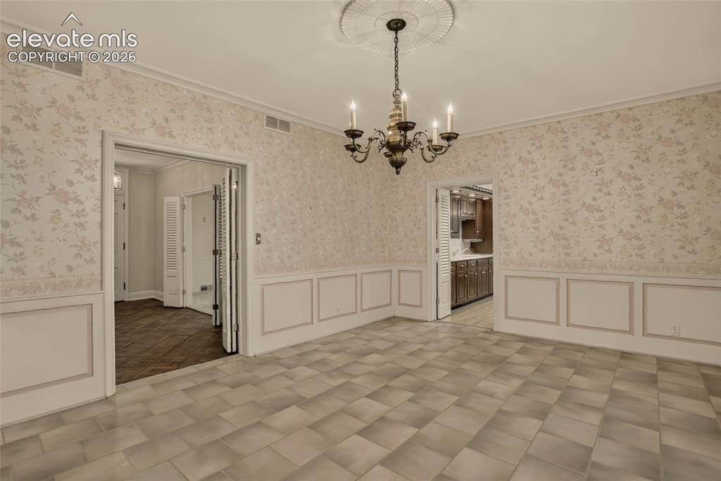 Image 12 of 49: Formal dining room.