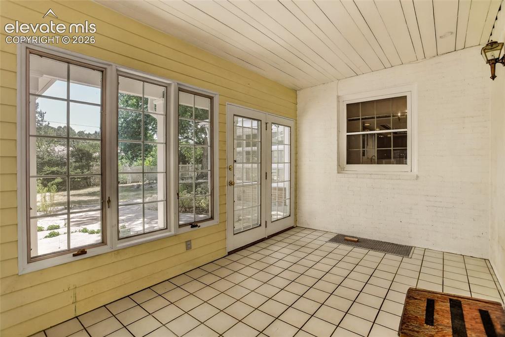 Image 42 of 49: Service porch between house and garage.