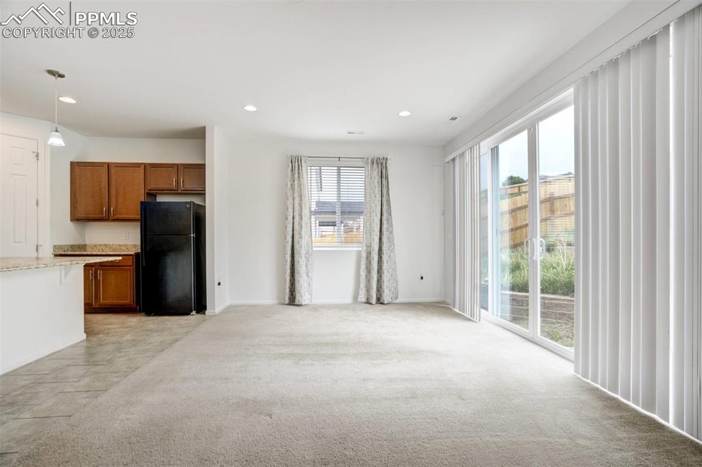 Image 4 of 36: Unfurnished living room featuring recessed lighting and light colored carpe