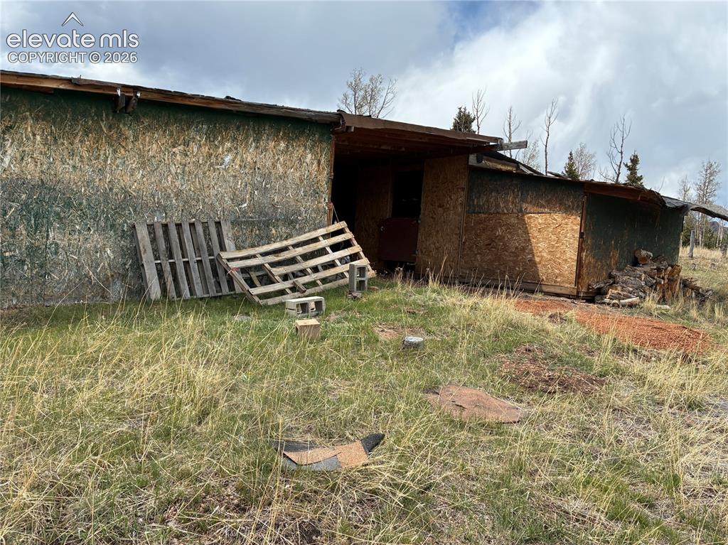 Image 27 of 30: Barn like structure needs TLC. Upgrade for stalls and fantastic storage spa