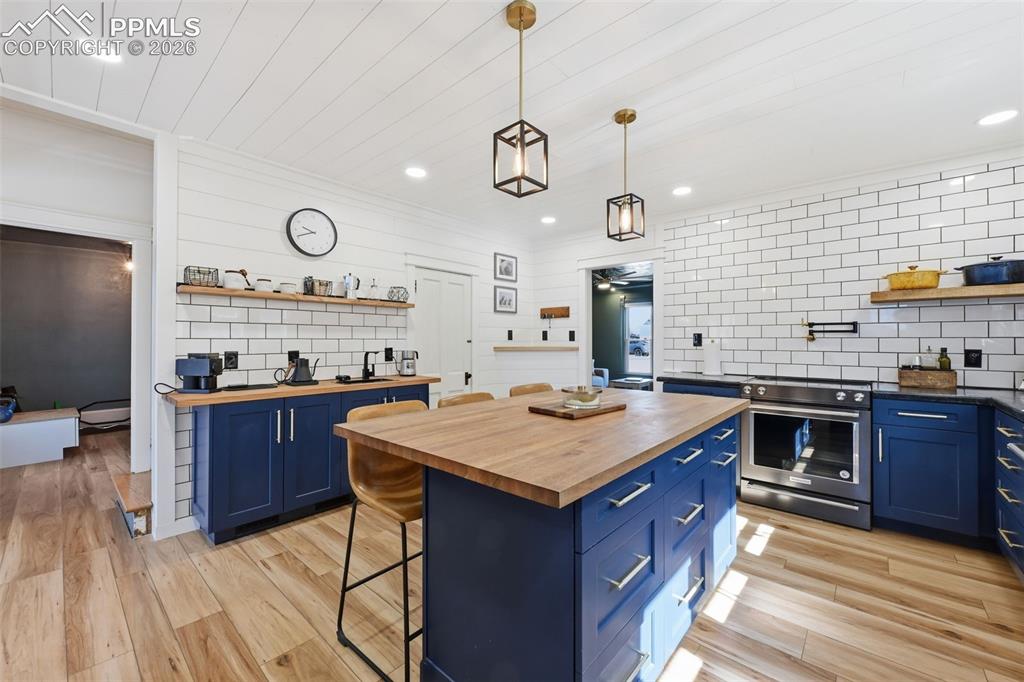 Image 11 of 50: Coffee bar features a vegetable sink.