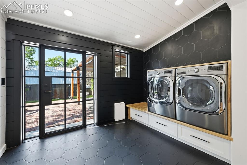 Image 14 of 50: The included washer and dryer are conveniently located off the kitchen.