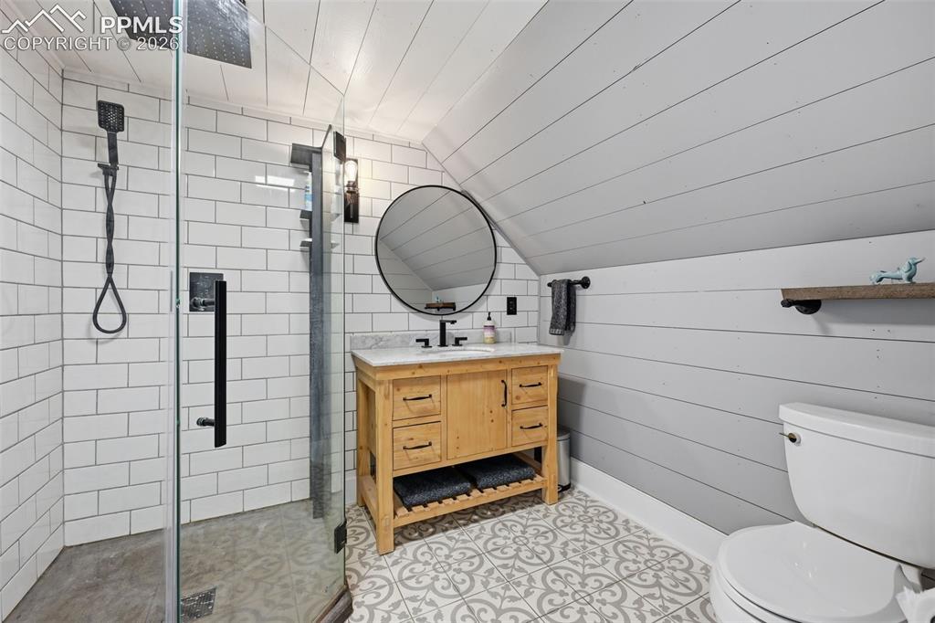 Image 18 of 50: The primary suite offers a 3/4 private bathroom with glass surround shower.