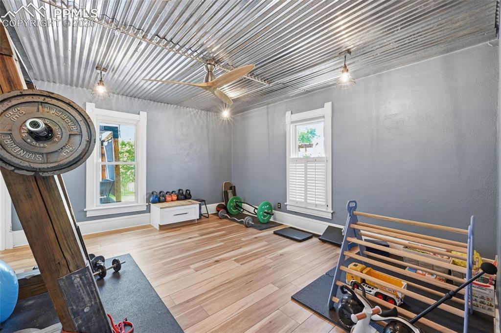 Image 6 of 50: Being used as an gym, this first floor bedroom offers endless possibilities