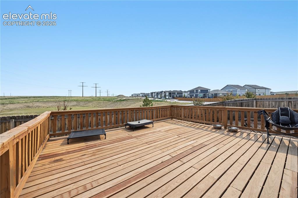 Image 10 of 45: Large backyard deck to enjoy the beautiful Colorado sunshine and great for