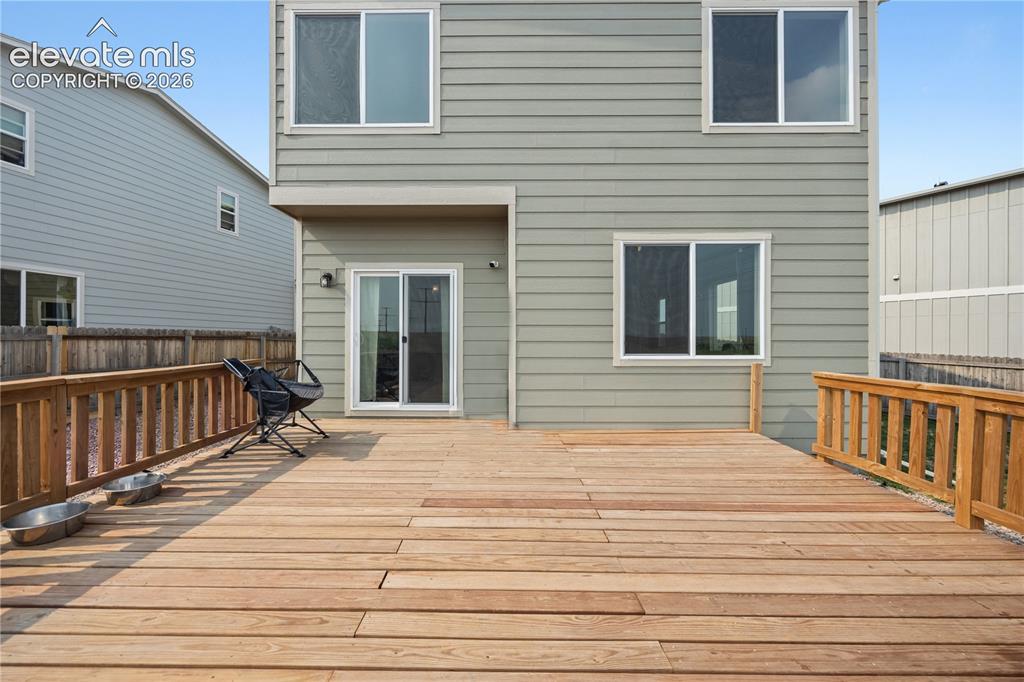 Image 11 of 45: The backyard deck is a great place to host weekend BBQs with family and fri