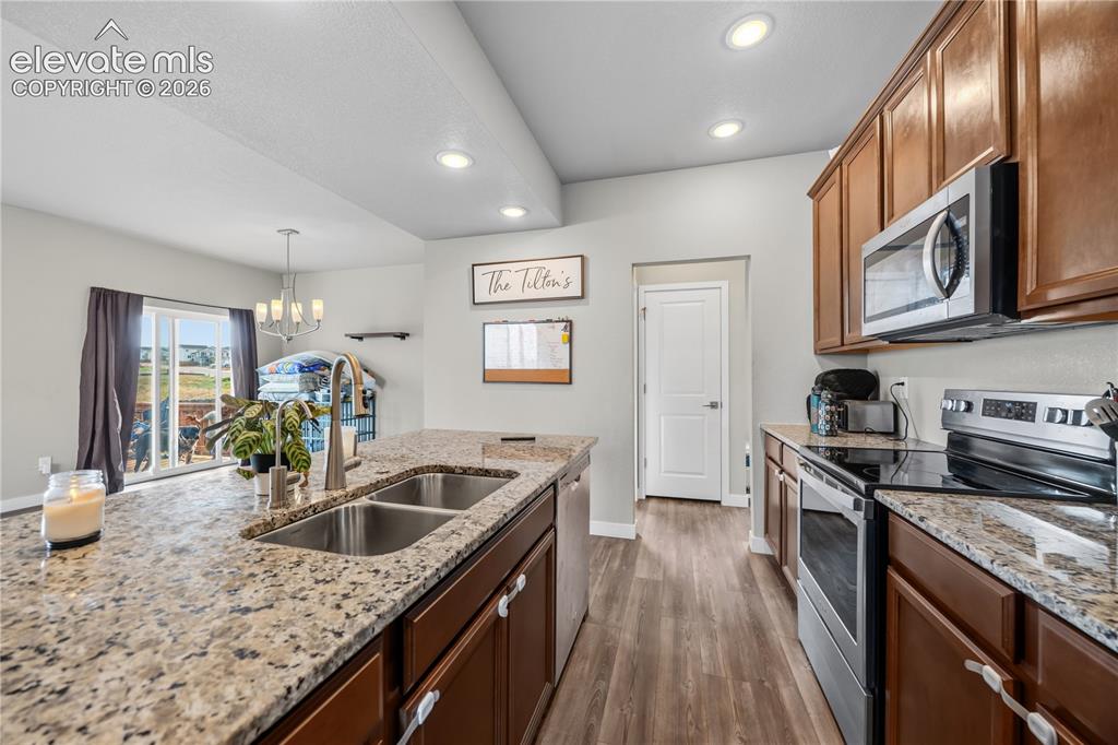 Image 14 of 45: View from the Kitchen into the Mud Room with garage access and the main lev