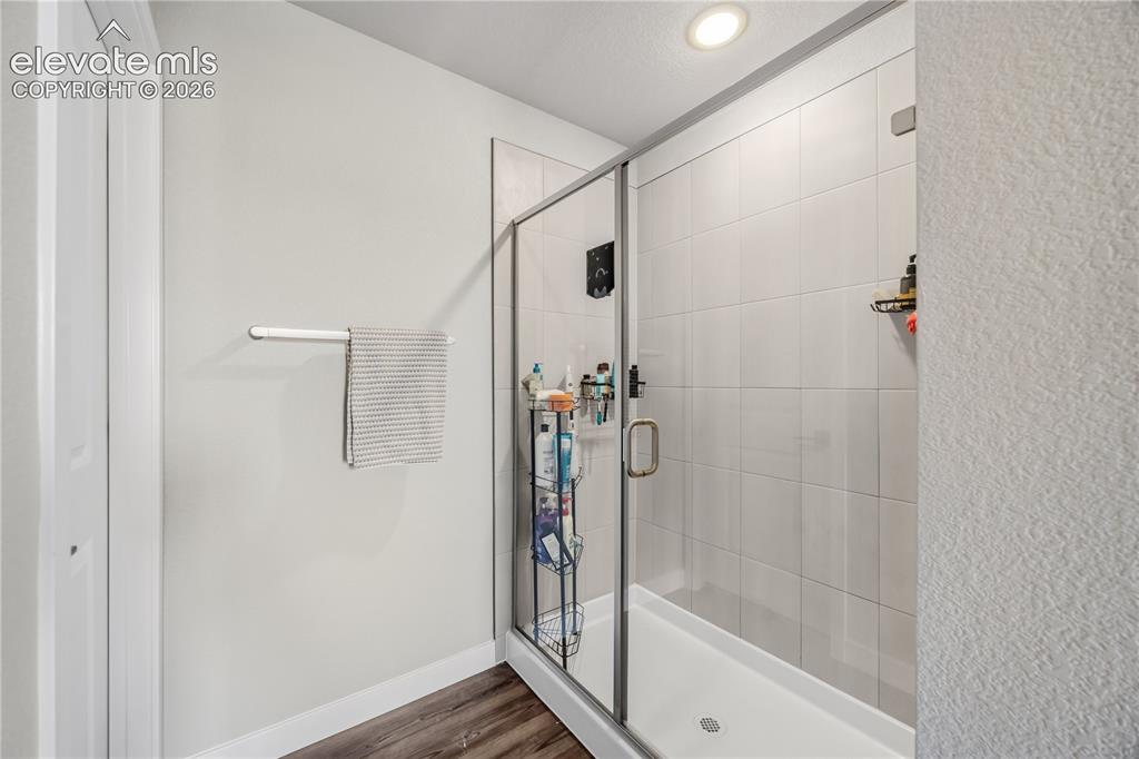Image 23 of 45: Enclosed tiled shower in the Primary Bathroom.