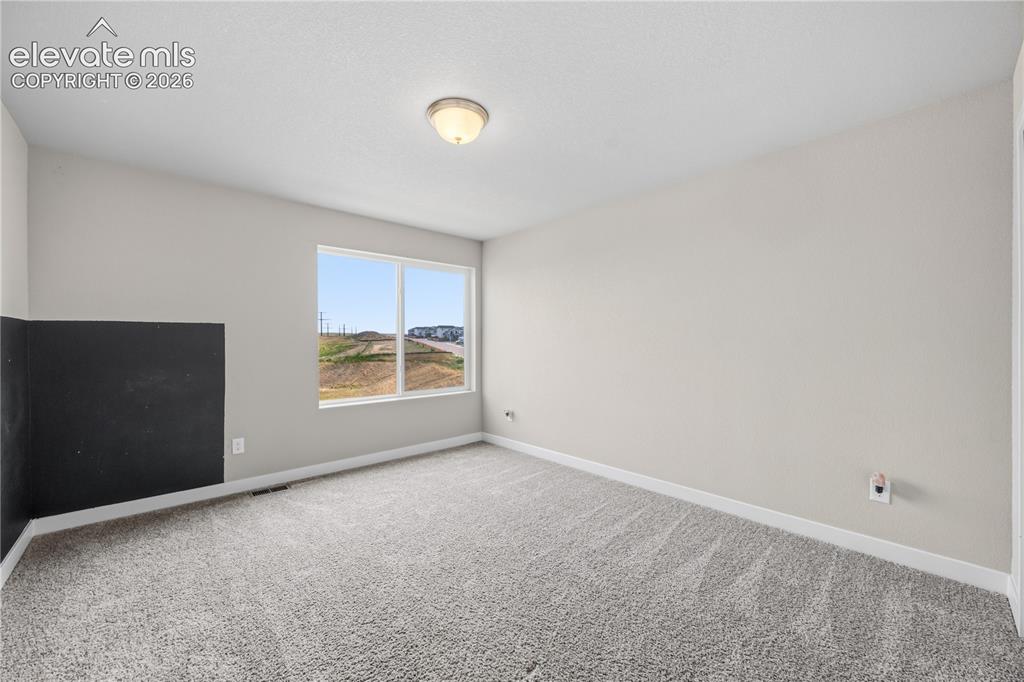 Image 25 of 45: Bedroom #2 has neutral carpet.