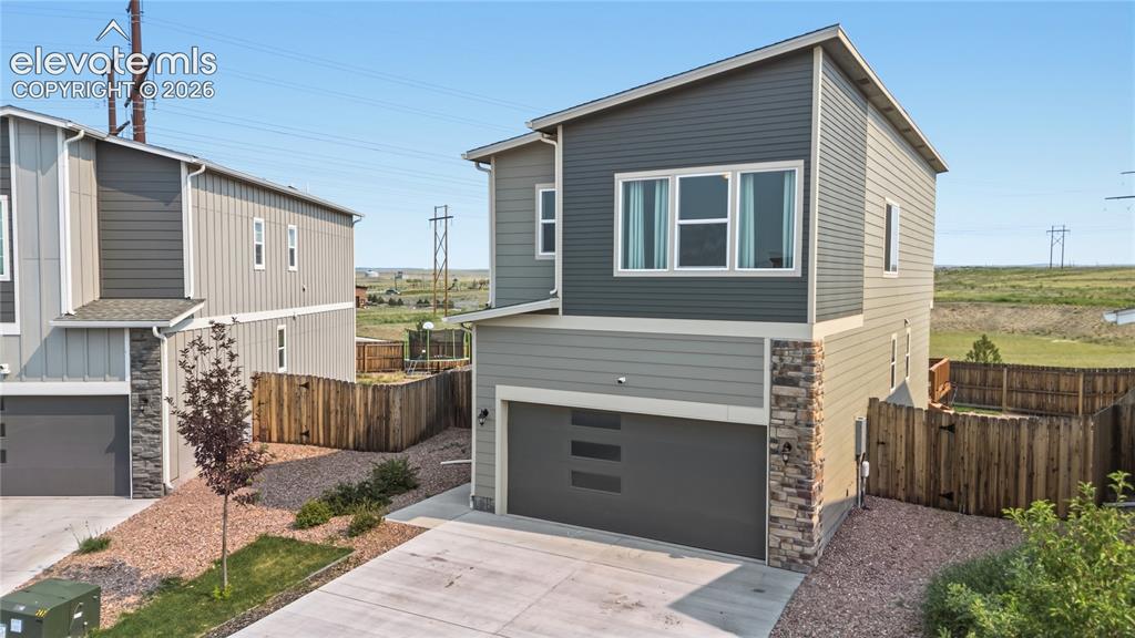 Image 3 of 45: Low maintenance, zeriscaped yard.