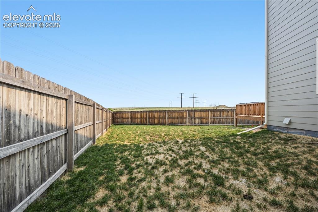 Image 38 of 45: Fenced side yard.