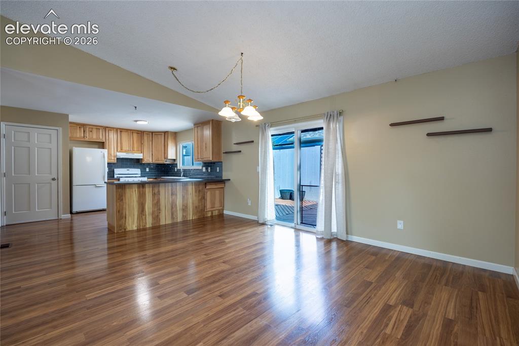 Image 8 of 26: Wood-finish flooring throughout the space