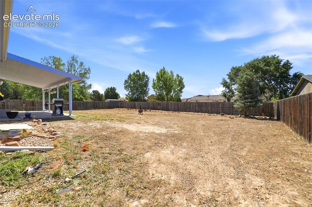 Image 43 of 46: Back Yard - The lot is 14,810 square feet.