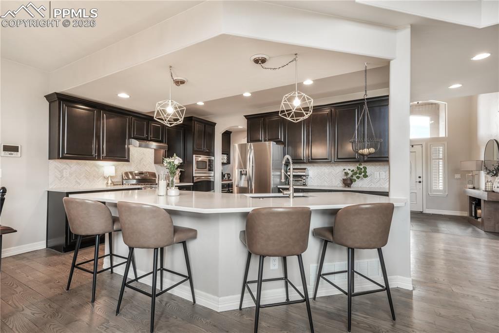 Image 13 of 50: Gourmet kitchen, stainless appliances, double ovens, large walk in pantry a