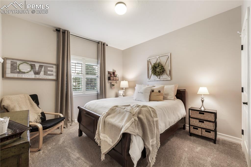 Image 19 of 50: Living room with vaulted ceilings and gas fireplace