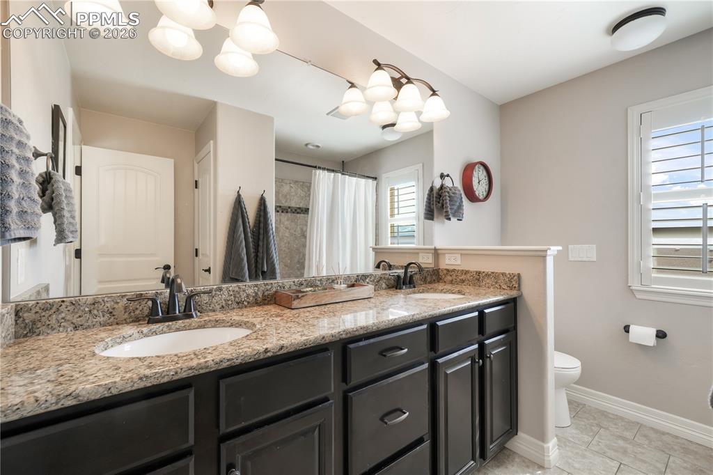 Image 32 of 50: Upper level primary 5  piece bath with dual vanities, large shower and larg