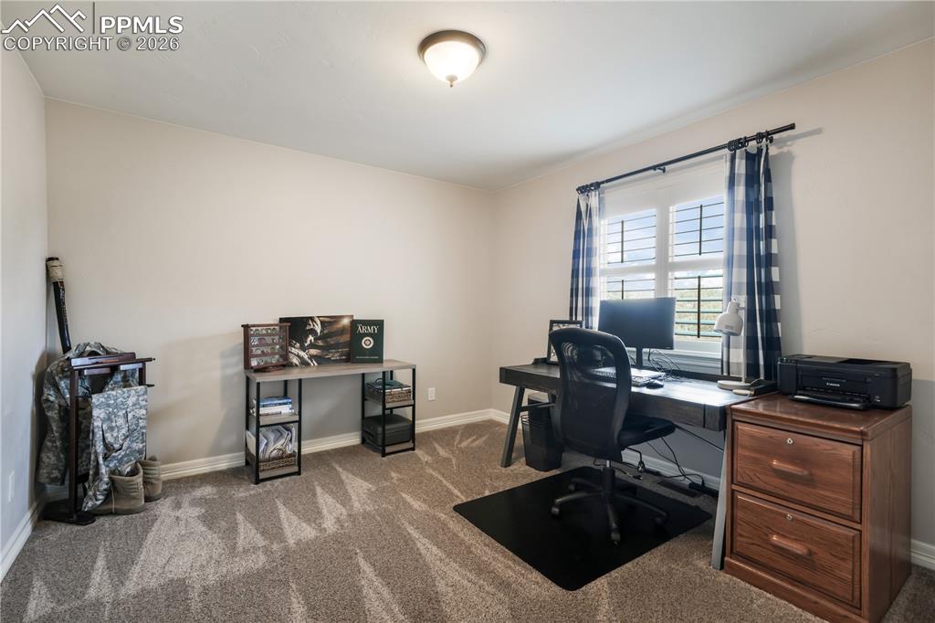 Image 36 of 50: Upper level laundry with sink and lots of storage