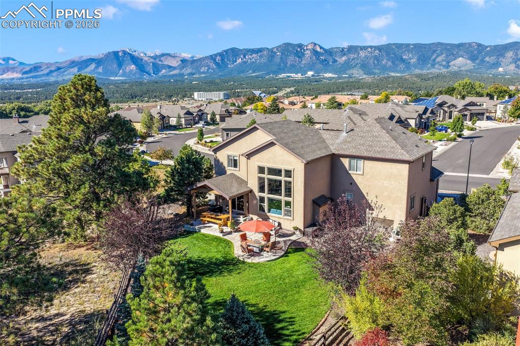 Image 4 of 50: Front of home with a large driveway