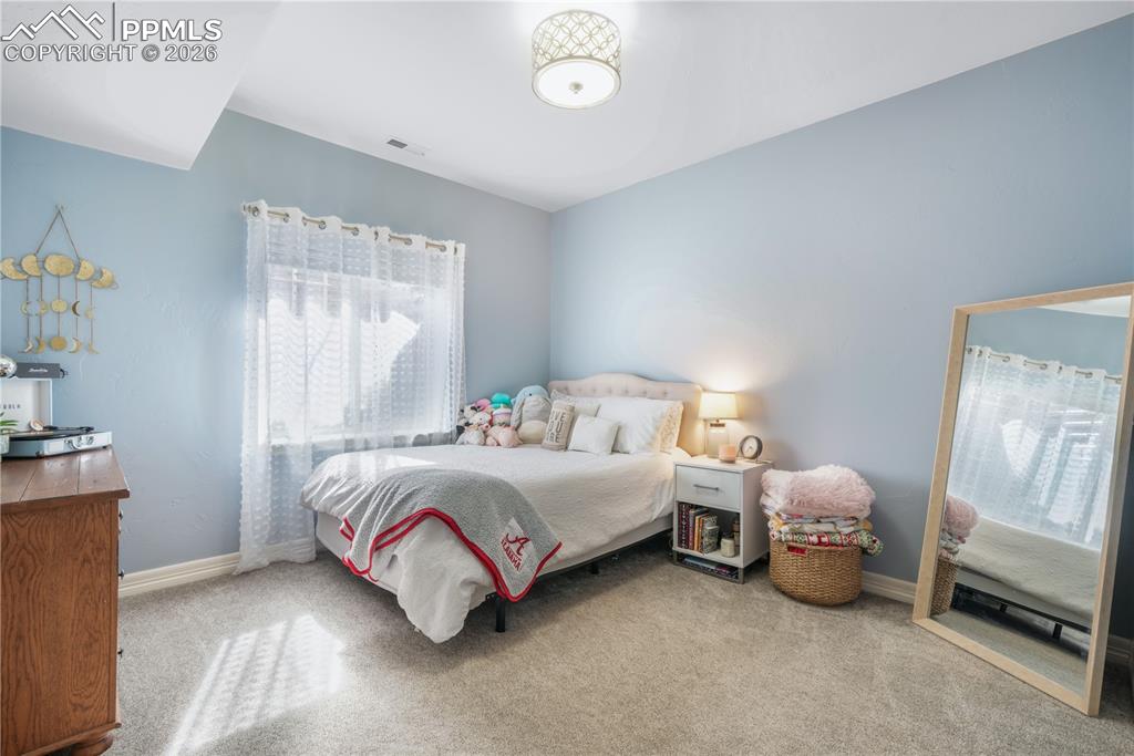 Image 41 of 50: Basement level family room, LVP flooring