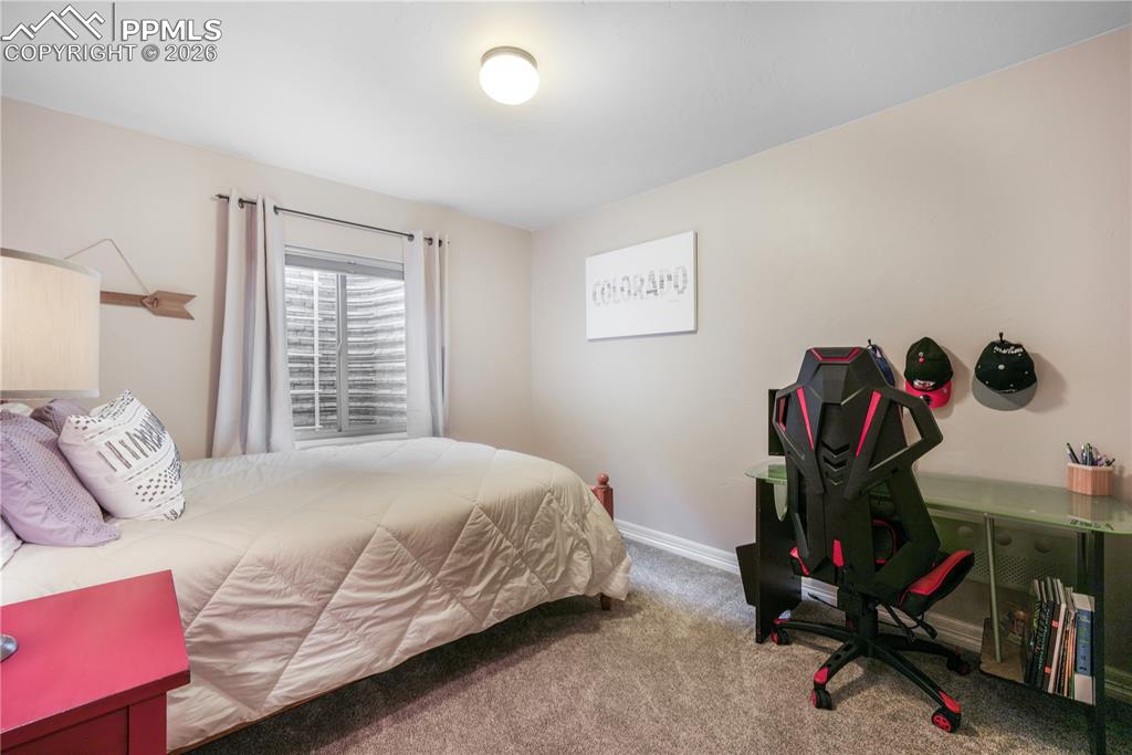 Image 44 of 50: Basement level 6th bedroom with large walk in closet and en suite access to