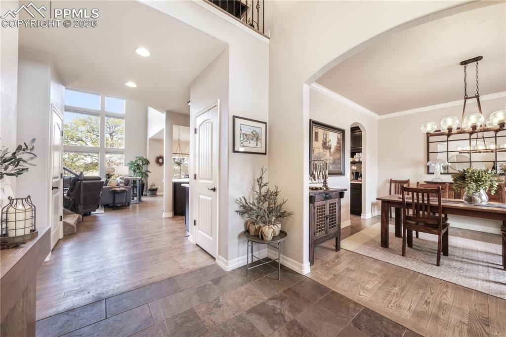 Image 7 of 50: Back of home, private landscaped and fenced yard, views of Pikes Peak