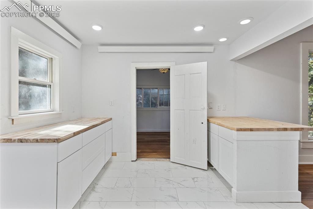 Image 18 of 49: Main-level flat kitchen