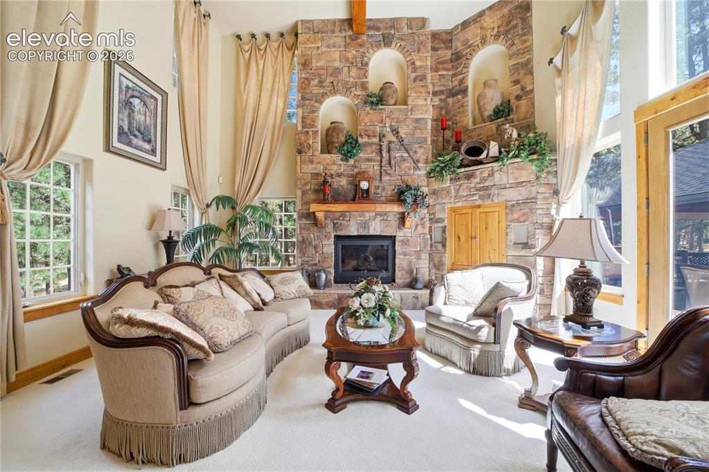 Image 16 of 50: great room sone fireplace 2 story high.