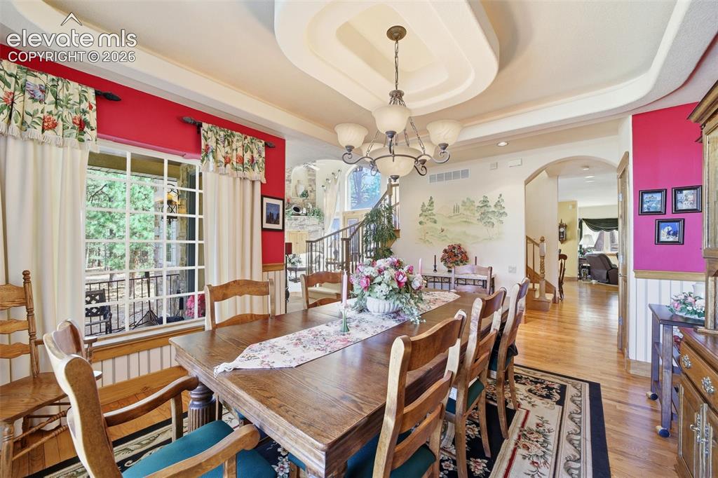 Image 21 of 50: Formal Dining Room with coffered ceilings